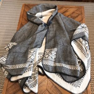 Hooded knit poncho with pockets